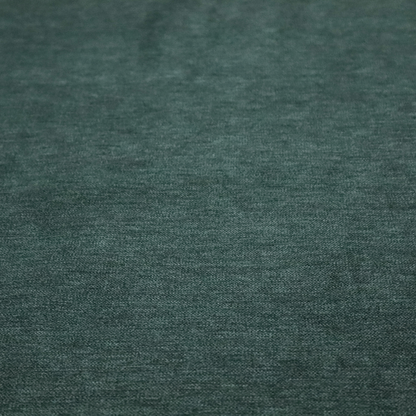 A solid teal or deep turquoise woven textile with a fine, subtle textured weave.