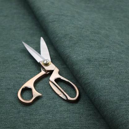 A solid teal or deep turquoise woven textile with a fine, subtle textured weave.