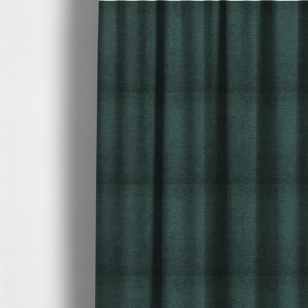 The fabric used to create these made-to-measure curtains is a solid teal or deep turquoise woven textile with a fine, subtle textured weave.