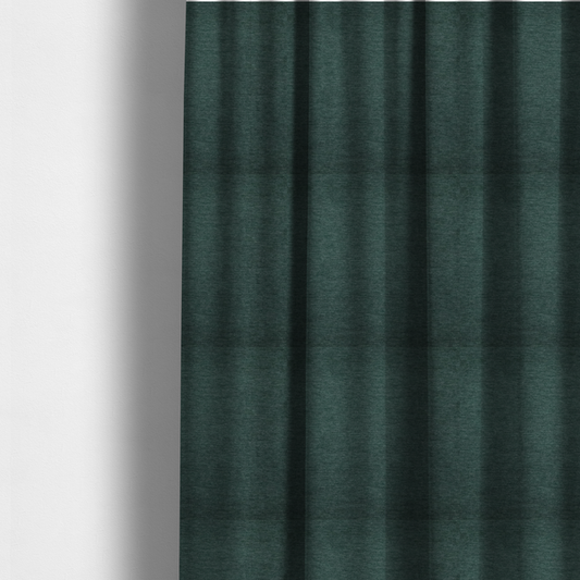 The fabric used to create these made-to-measure curtains is a solid teal or deep turquoise woven textile with a fine, subtle textured weave.