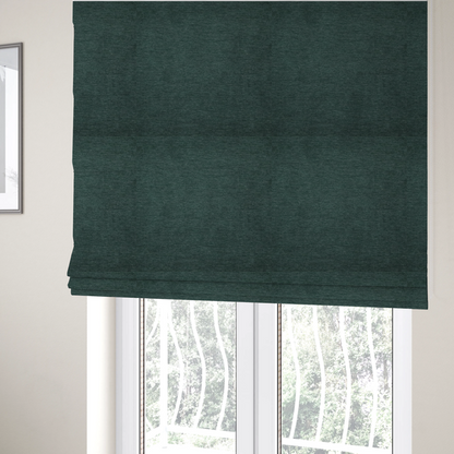 the fabric used to create these Roman blinds is a solid teal or deep turquoise woven textile with a fine, subtle textured weave.
