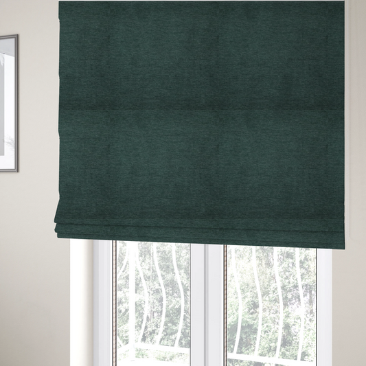 the fabric used to create these Roman blinds is a solid teal or deep turquoise woven textile with a fine, subtle textured weave.