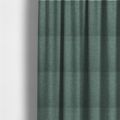the fabric used to create these made-to-measure curtains is a solid light teal or seafoam green woven textile with a fine, subtle textured weave.