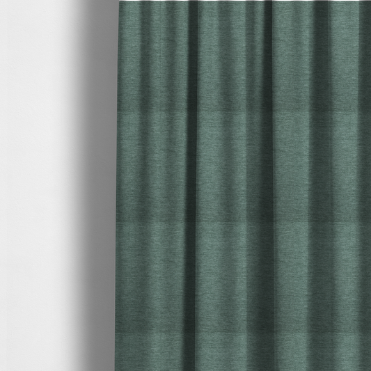 the fabric used to create these made-to-measure curtains is a solid light teal or seafoam green woven textile with a fine, subtle textured weave.