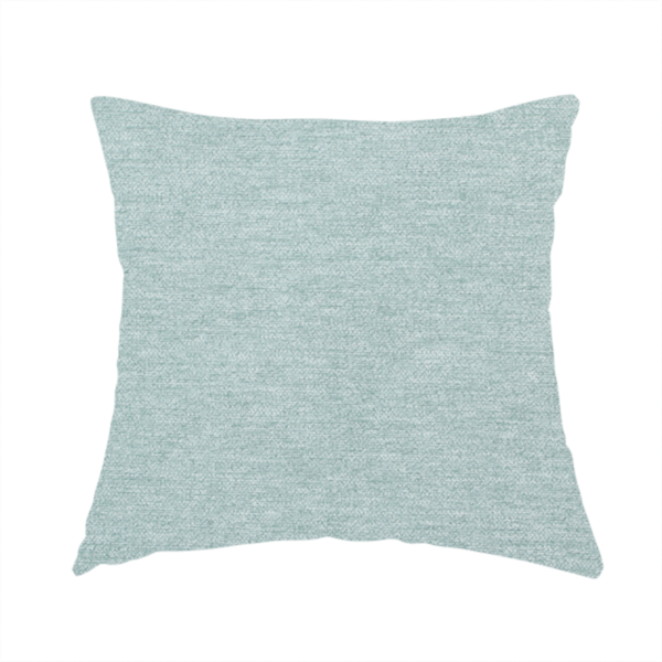 The fabric used to create this handmade cushion is a solid pale aqua or mint green woven textile with a fine, subtle textured weave.
