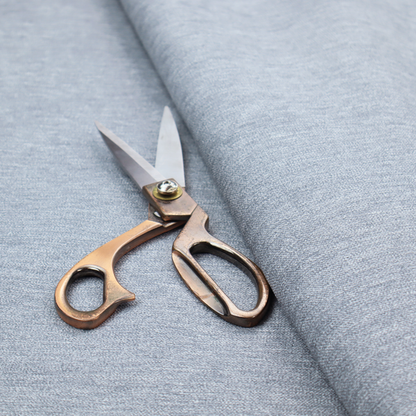 A solid light periwinkle woven fabric swatch with a fine, subtle texture.
