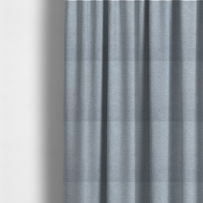 The fabric used to create these made-to-measure curtains is a solid light periwinkle woven fabric swatch with a fine, subtle texture.