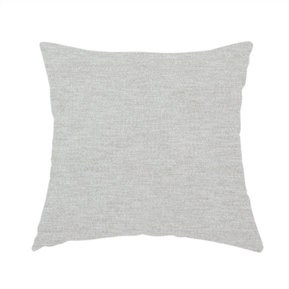 The fabric used to create this handmade cushion is a light grey or silver woven textile with a fine, subtle textured weave.