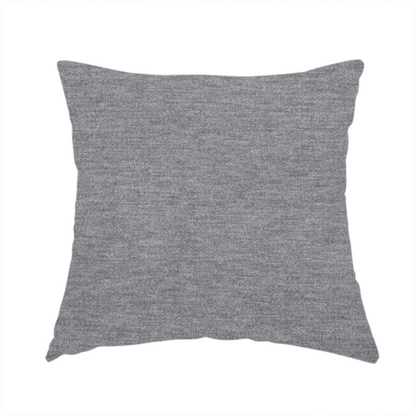 The fabric used to create this handmade cushion is a solid dark grey or charcoal woven textile with a fine, subtle textured weave.