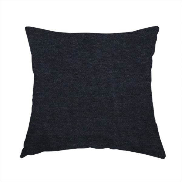 The fabric used to create this handmade cushion is a solid dark charcoal or near-black woven textile with a fine, subtle textured weave.