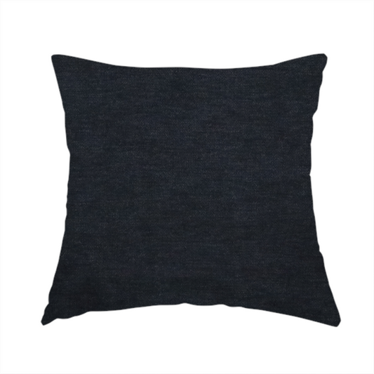 The fabric used to create this handmade cushion is a solid dark charcoal or near-black woven textile with a fine, subtle textured weave.