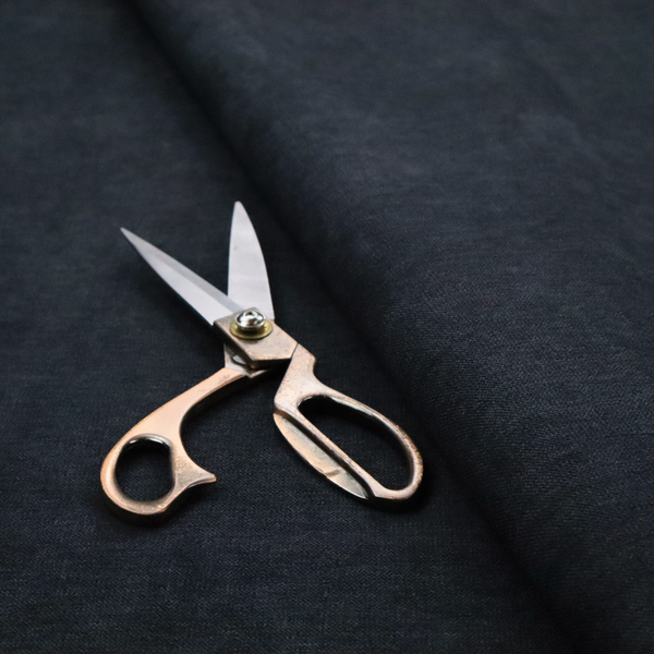 A solid dark charcoal or near-black woven textile with a fine, subtle textured weave.