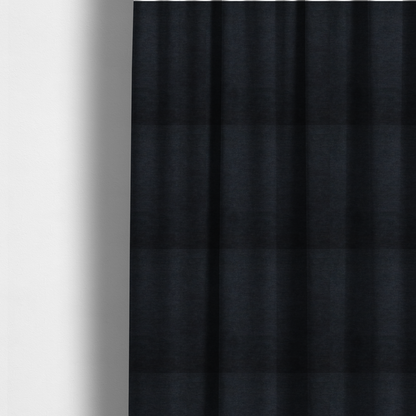 The fabric used to create these made-to-measure curtains is a solid dark charcoal or near-black woven textile with a fine, subtle textured weave.