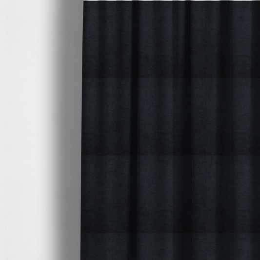 The fabric used to create these made-to-measure curtains is a solid dark charcoal or near-black woven textile with a fine, subtle textured weave.