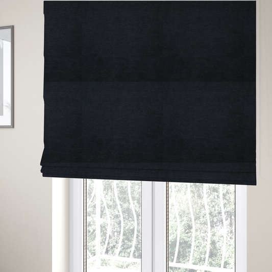 The fabric used to create these Roman blinds is a solid dark charcoal or near-black woven textile with a fine, subtle textured weave.
