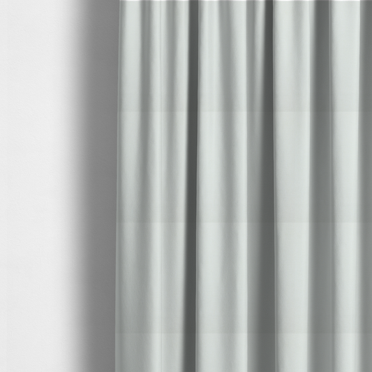 The fabric used to create these made-to-measure curtains is a light grey or off-white fabric with a tight, fine weave texture.