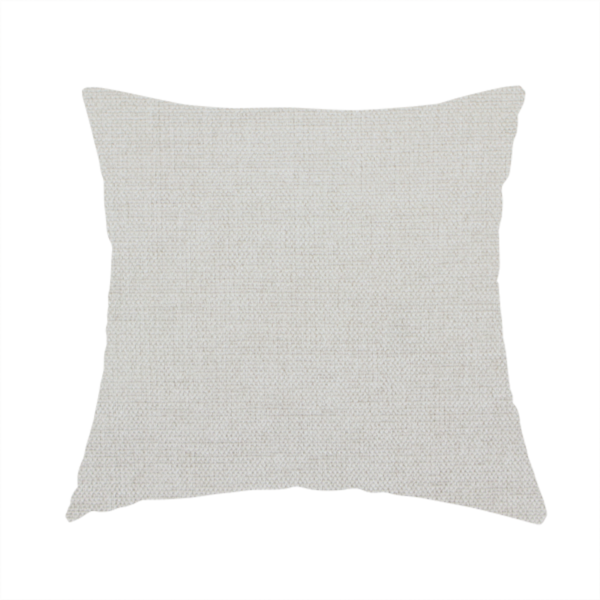 The fabric used to create this handmade cushion is a textured, light beige or cream-coloured woven upholstery fabric.