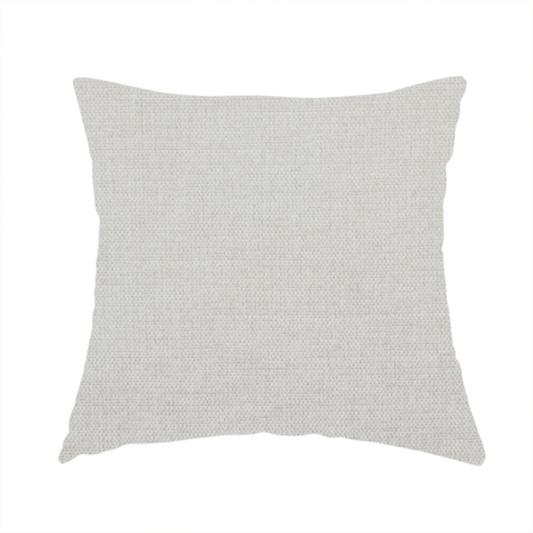 The fabric used to create this handmade cushion is a textured, light beige or cream-coloured woven upholstery fabric.