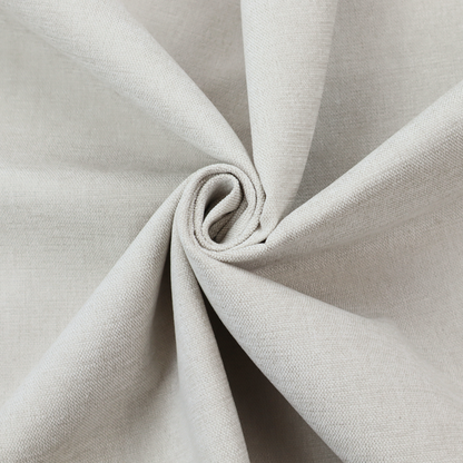 A textured, light beige or cream-coloured woven upholstery fabric.