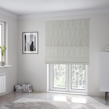The fabric used to create these Roman blinds is a textured, light beige or cream-coloured woven upholstery fabric.