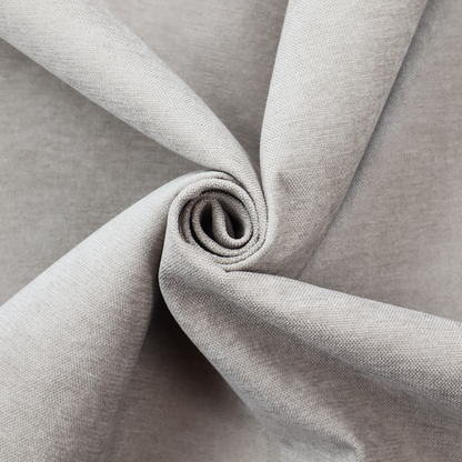 A textured, light taupe or greyish-beige woven upholstery fabric.