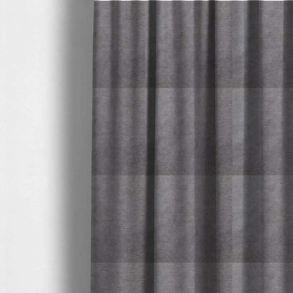 The fabric used to create these made-to-measure curtains is a textured, medium grey woven upholstery fabric.