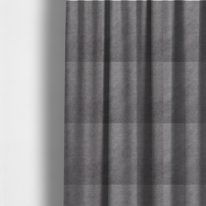 The fabric used to create these made-to-measure curtains is a textured, medium grey woven upholstery fabric.