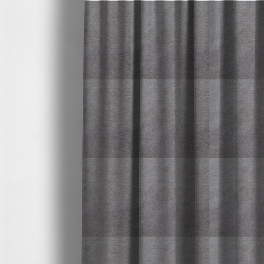 The fabric used to create these made-to-measure curtains is a textured, medium grey woven upholstery fabric.