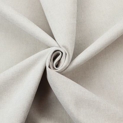 A textured, light beige woven upholstery fabric.