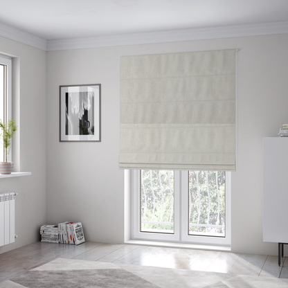 The fabric used to create these Roman blinds is a textured, light beige woven upholstery fabric.