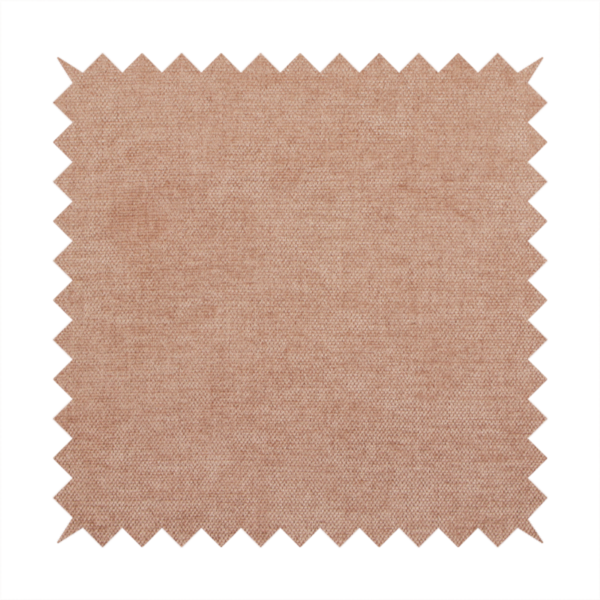 A textured, warm peach or terracotta-coloured woven upholstery fabric.