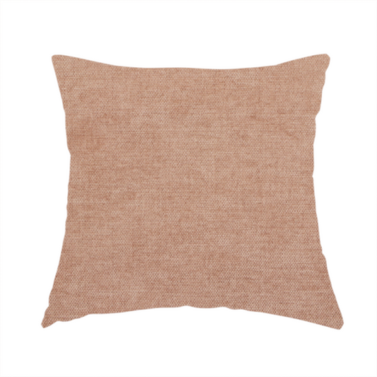 The fabric used to create this handmade cushion is a textured, warm peach or terracotta-coloured woven upholstery fabric.