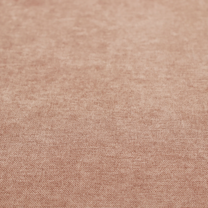 A textured, warm peach or terracotta-coloured woven upholstery fabric.