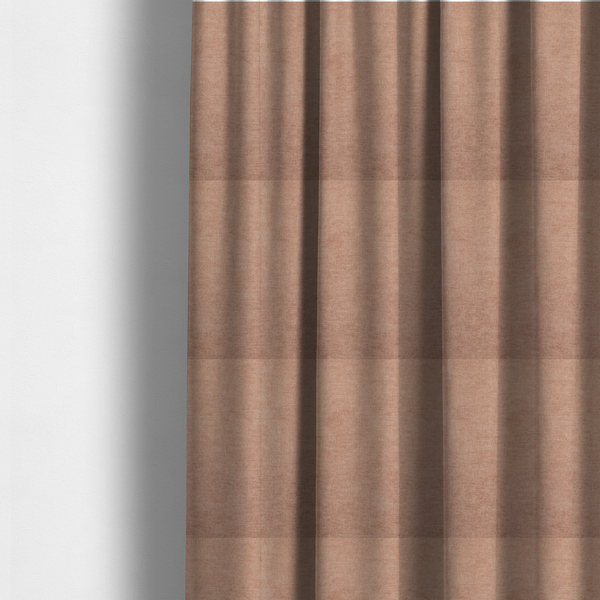 The fabric used to create these made-to-measure curtains is a textured, warm peach or terracotta-coloured woven upholstery fabric.