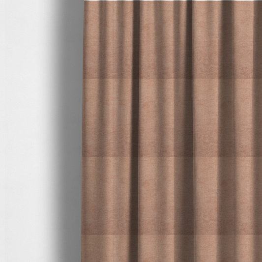 The fabric used to create these made-to-measure curtains is a textured, warm peach or terracotta-coloured woven upholstery fabric.