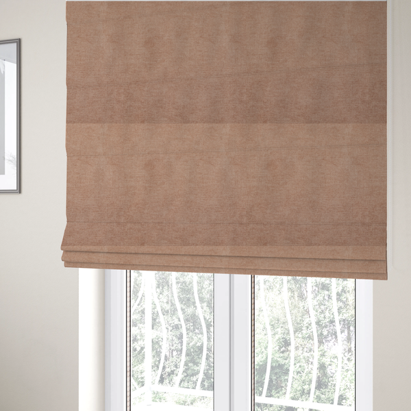 The fabric used to create these Roman blinds is a textured, warm peach or terracotta-coloured woven upholstery fabric.
