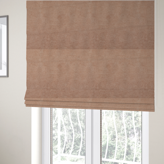 The fabric used to create these Roman blinds is a textured, warm peach or terracotta-coloured woven upholstery fabric.