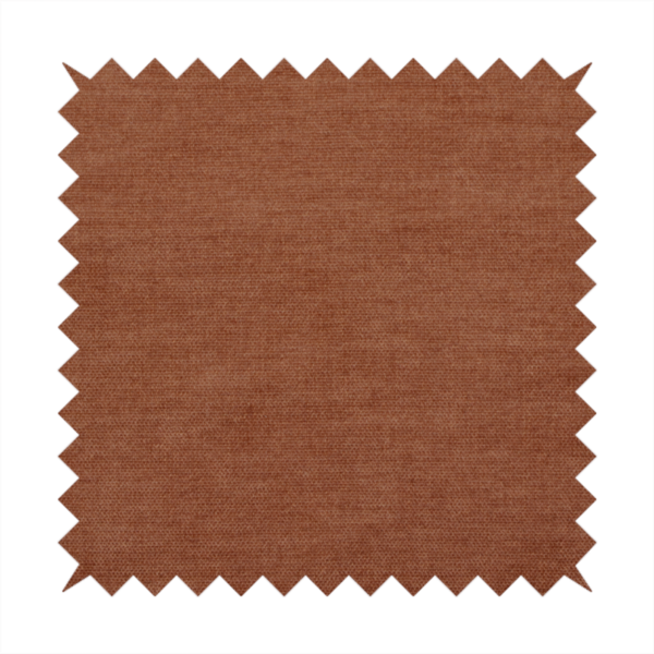 A textured, rich rust or burnt orange woven upholstery fabric.