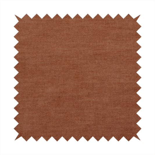 A textured, rich rust or burnt orange woven upholstery fabric.