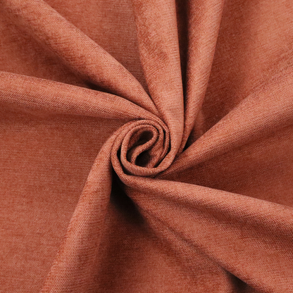A textured, vibrant burnt orange or coral-coloured woven upholstery fabric.