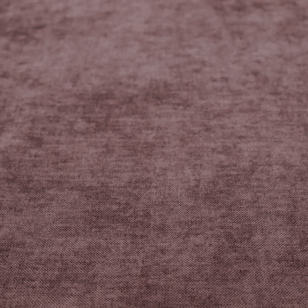 A textured, dusty mauve or muted purple woven upholstery fabric.