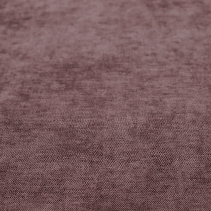 A textured, dusty mauve or muted purple woven upholstery fabric.