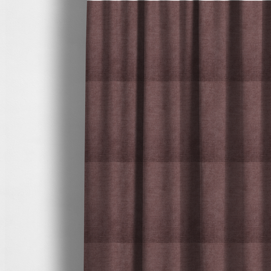 The fabric used to create these made-to-measure curtains is a textured, dusty mauve or muted purple woven upholstery fabric.