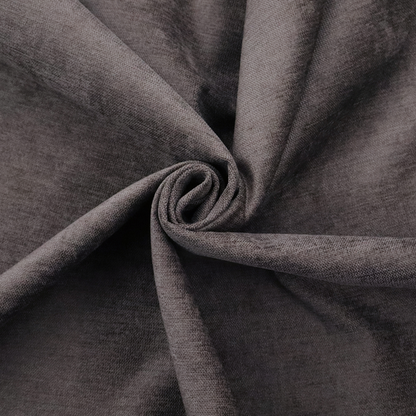 A textured, dark charcoal grey or brown-grey woven upholstery fabric.