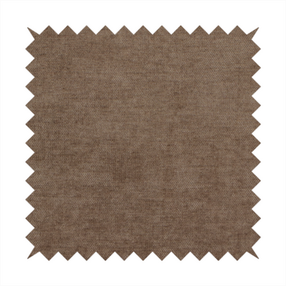 A textured, medium brown or bronze woven upholstery fabric.