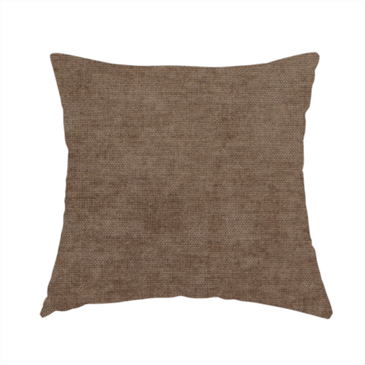 The fabric used to create this handmade cushion is a textured, medium brown or bronze woven upholstery fabric.