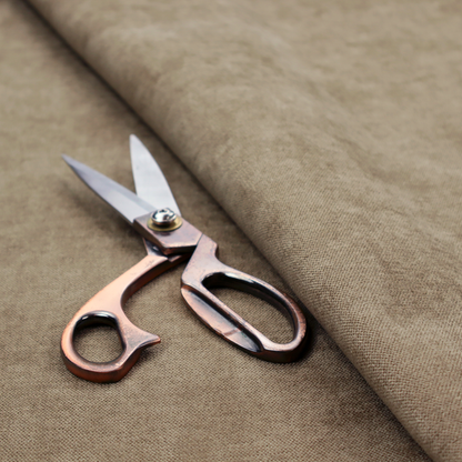 A textured, warm khaki or golden beige woven upholstery fabric.