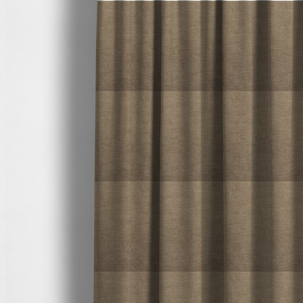 The fabric used to create these made-to-measure curtains is a textured, warm khaki or golden beige woven upholstery fabric.