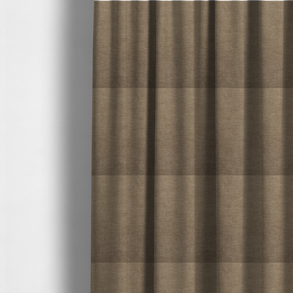The fabric used to create these made-to-measure curtains is a textured, warm khaki or golden beige woven upholstery fabric.