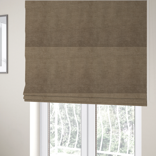 The fabric used to create these Roman blinds is a textured, warm khaki or golden beige woven upholstery fabric.